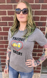 Jasmine is wearing the grey tacos and beer shirt.